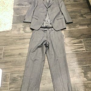 Men’s grey Calvin Klein brand suit from Men’s Wearhouse.